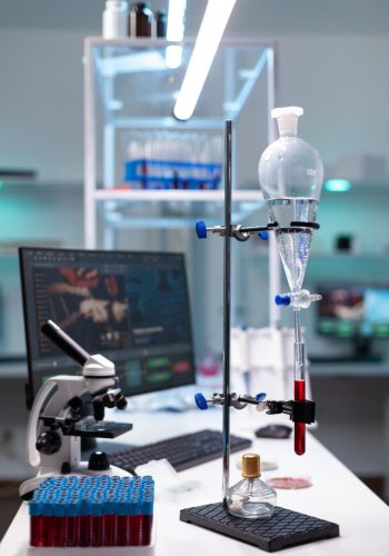 science-laboratory-equipment-test-tube-with-blood-healthcare-development-chemical-dripping-pipe-with-glass-flask-analysis-biochemistry-lab-clinic-professional-instruments